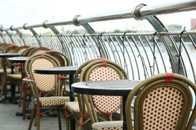 Stylish chairs and tables on cafe terrace