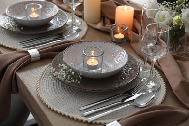 Photo of Festive table setting with beautiful floral decor in restaurant