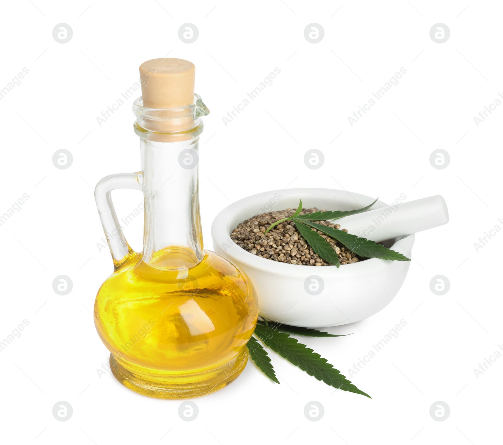 Photo of Hemp oil, fresh leaves and seeds on white background