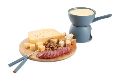 Fondue with tasty melted cheese, forks and different snacks isolated on white