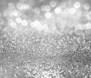 Shiny silver glitter as background. Bokeh effect