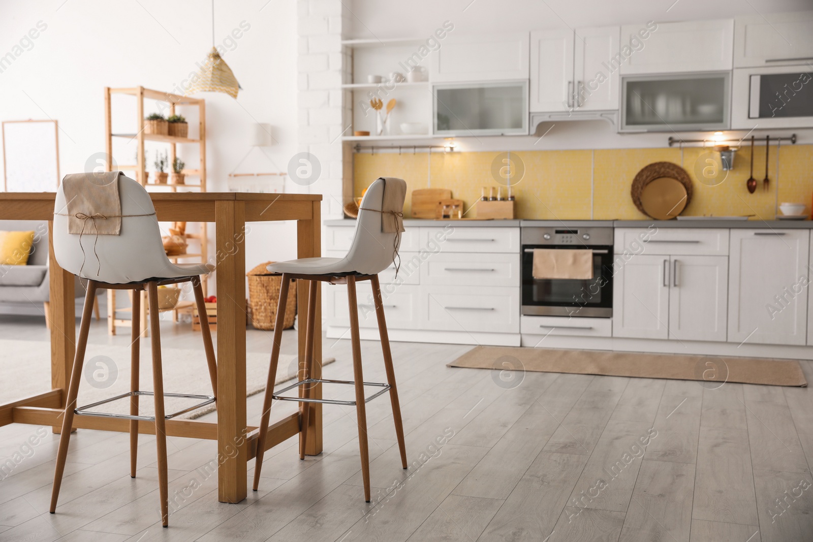 Photo of Modern kitchen interior with stylish wooden table