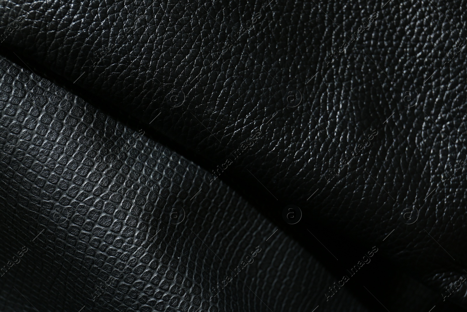 Photo of Black natural leather as background, top view