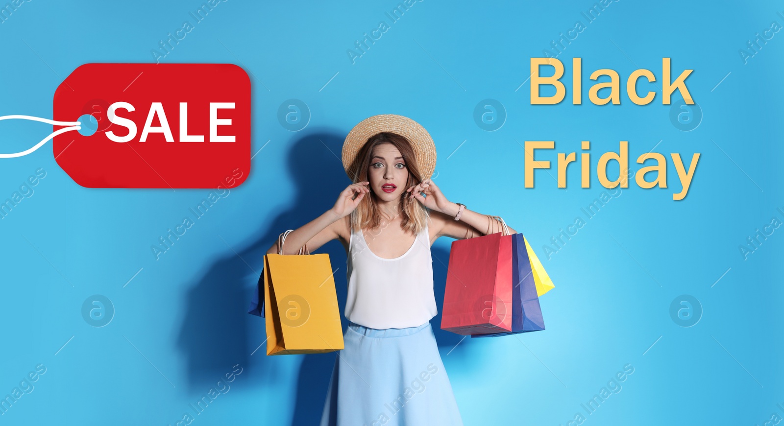 Image of Black Friday Sale. Beautiful young woman with shopping bags on light blue background 
