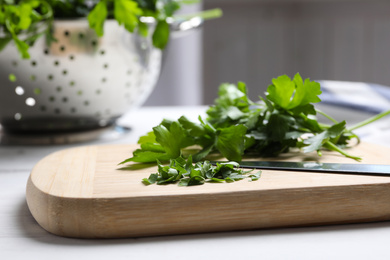 Bunch of fresh green parsley on wooden table, closeup