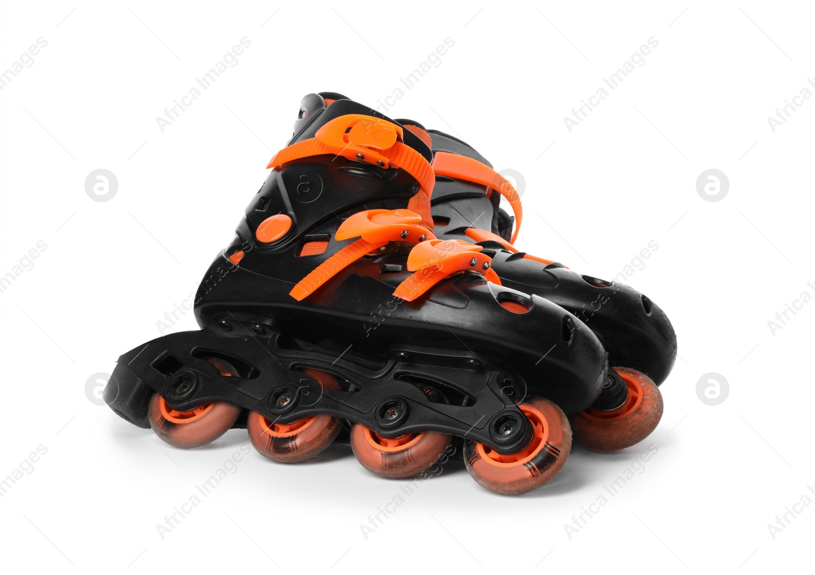 Photo of Pair of inline roller skates on white background