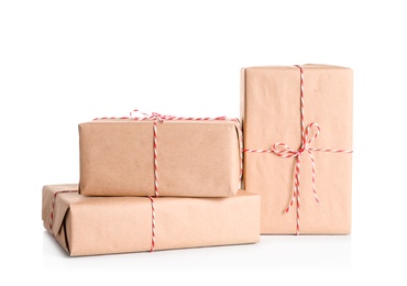 Photo of Beautifully wrapped gift boxes on white background