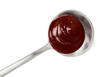 Photo of Tasty barbecue sauce and spoon isolated on white, top view