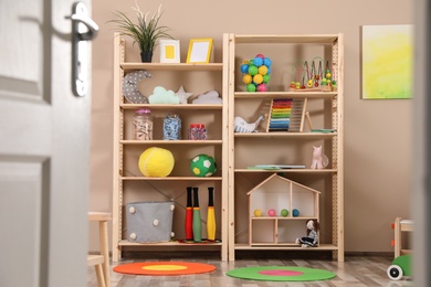 Storage for toys in colorful child's room. Idea for interior design