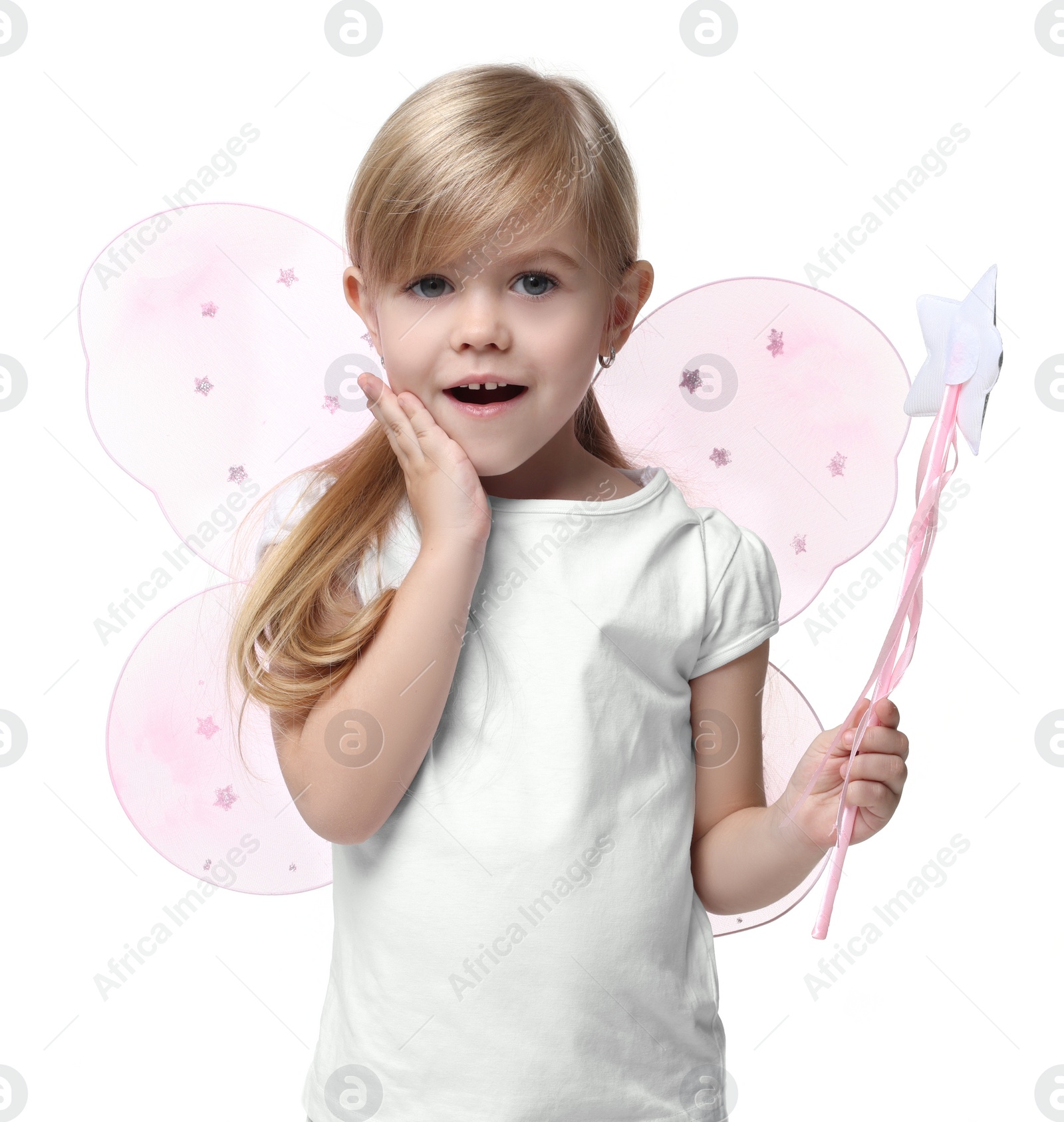 Photo of Surprised little girl in fairy costume with pink wings and magic wand on white background