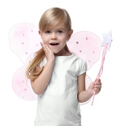 Surprised little girl in fairy costume with pink wings and magic wand on white background