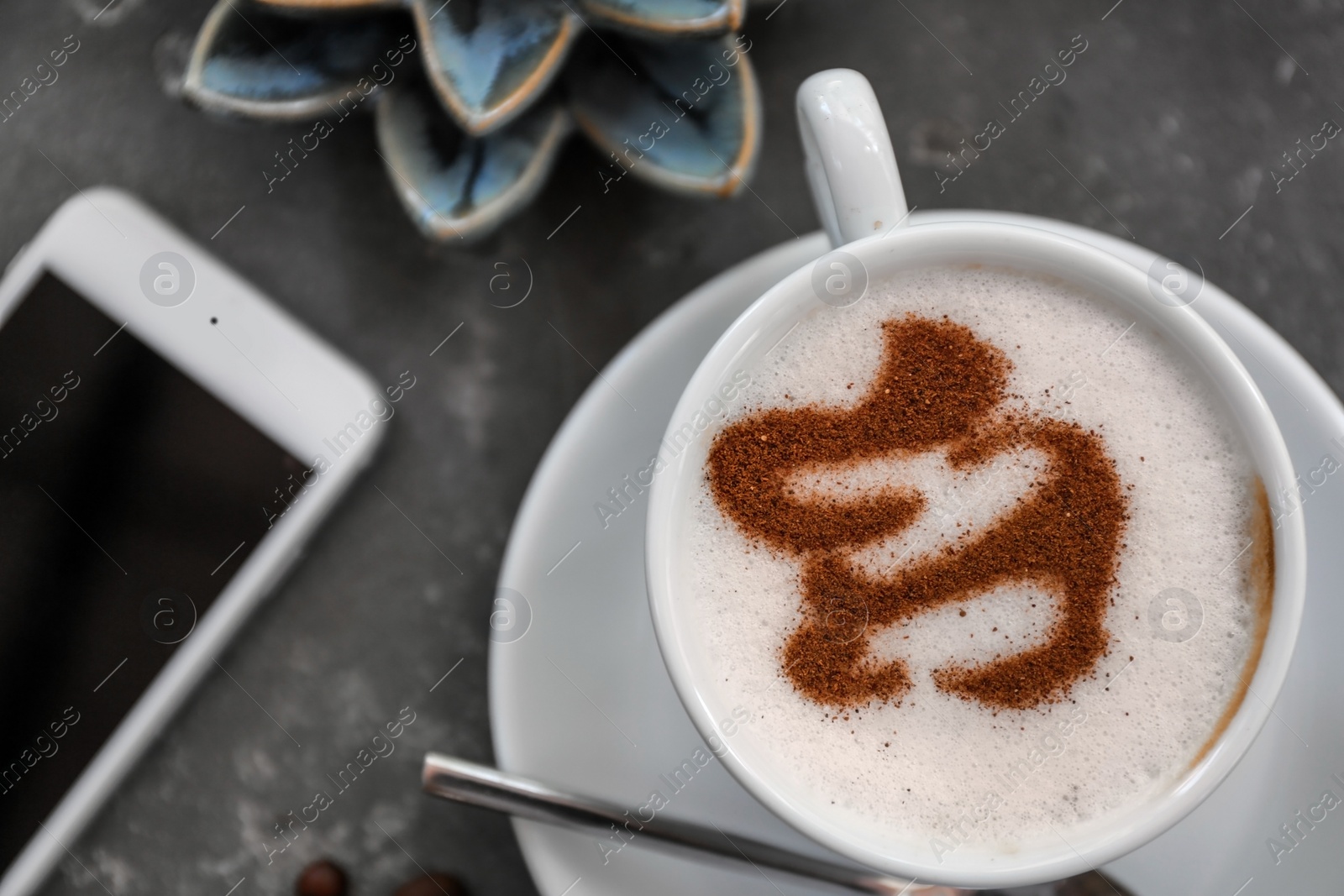 Photo of Cup of fresh aromatic coffee on table, top view