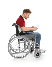 Young man in wheelchair using tablet isolated on white