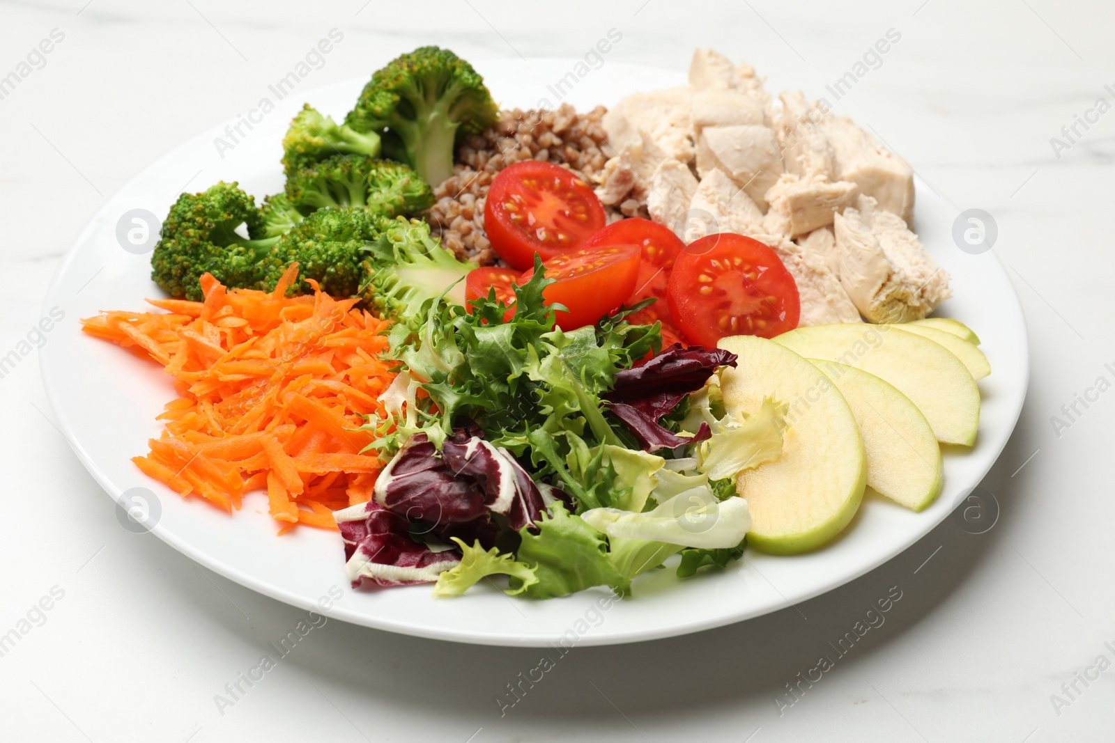 Photo of Balanced diet and healthy foods. Plate with different delicious products on white marble table, closeup