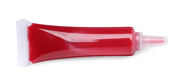 Tube with red food coloring isolated on white, top view