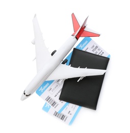 Photo of Toy airplane and passport with tickets on white background, top view