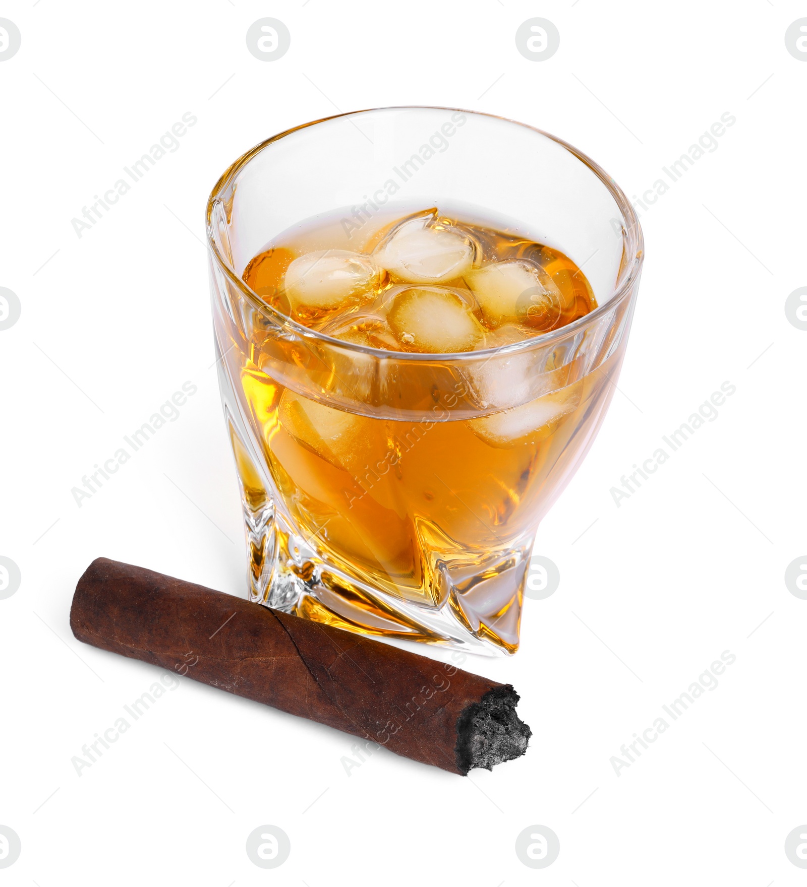 Photo of Glass of whiskey and burnt cigar isolated on white