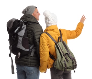 Photo of Couple with backpacks on white background, back view. Winter travel