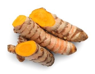 Photo of Fresh cut turmeric roots isolated on white, top view