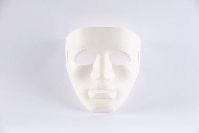 Plastic face mask on white background. Theatrical performance