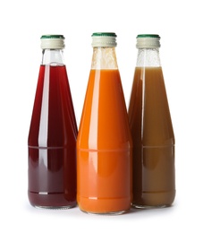 Photo of Bottles with different drinks on white background