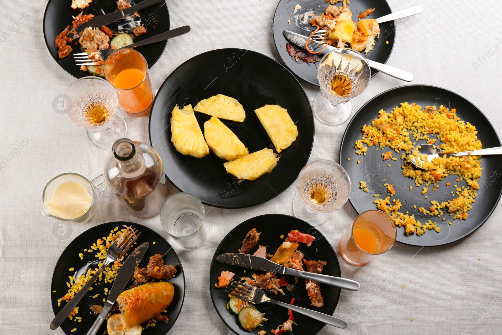 Photo of Composition with food leftovers after party on table, above view