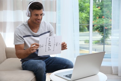 Photo of Teacher giving online lesson during quarantine. Studying at home