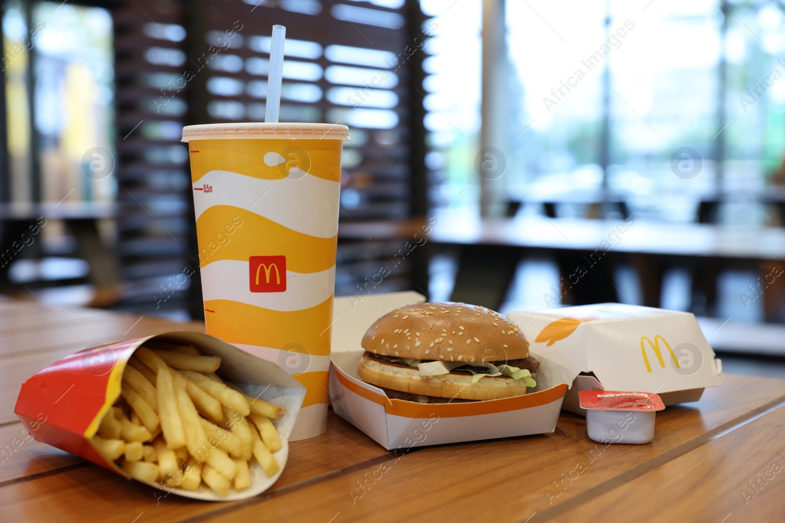 Photo of Lviv, Ukraine - October 9, 2023: McDonald's menu on wooden table in restaurant