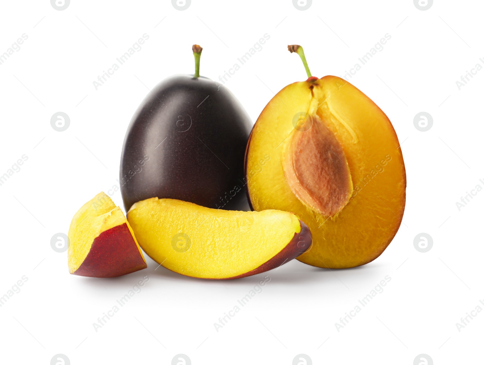 Photo of Whole and cut ripe plums on white background