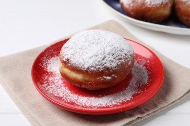 Photo of Delicious sweet bun on white table, closeup