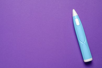 Photo of Stylish 3D pen on violet background, top view. Space for text