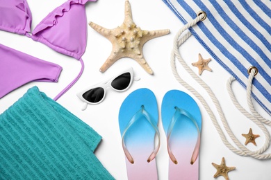 Photo of Flat lay composition with beach objects on white background