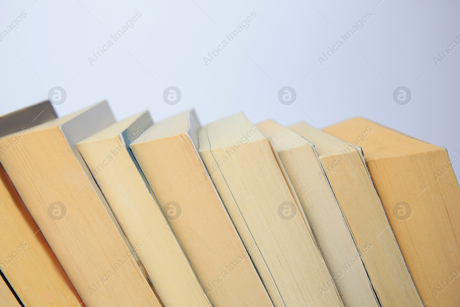 Photo of Collection of different books on light background