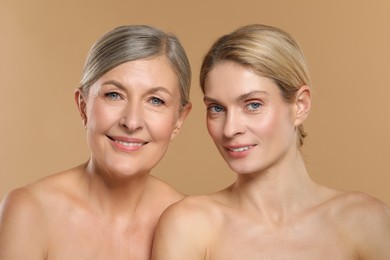 Beautiful women with healthy skin on beige background
