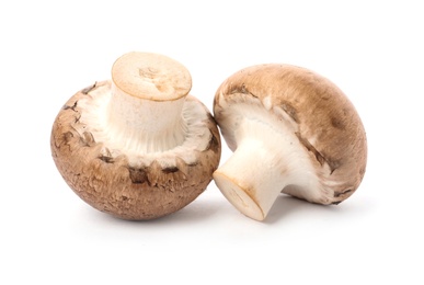 Photo of Fresh raw champignon mushrooms on white background