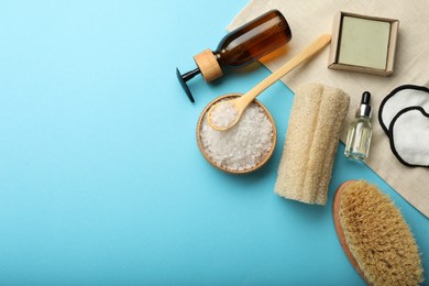 Photo of Flat lay composition with eco friendly products on light blue background, space for text