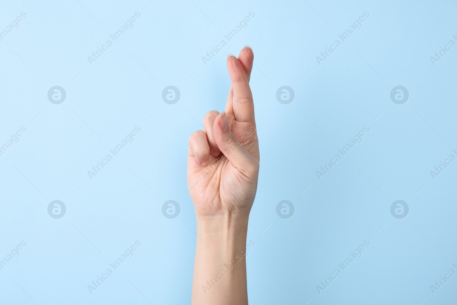 Photo of Woman showing R letter on color background, closeup. Sign language