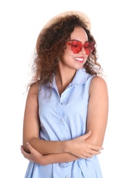 Young beautiful African-American woman wearing heart shaped glasses on white background