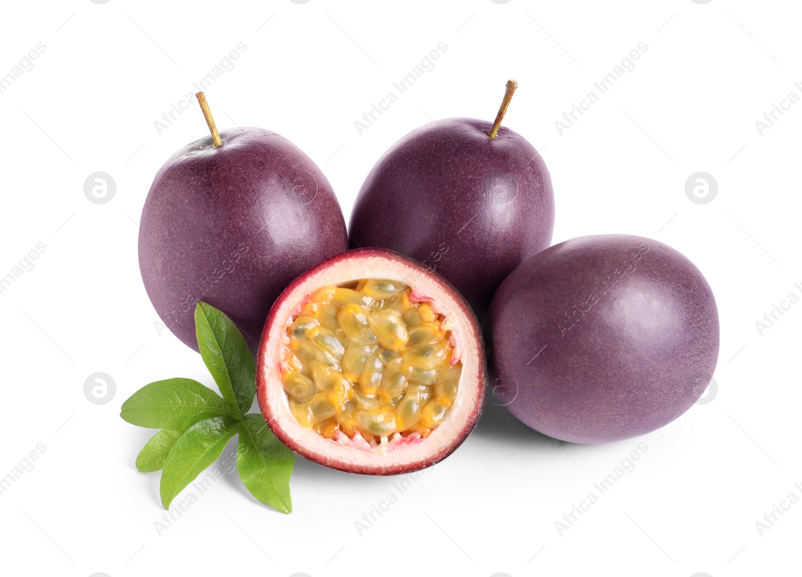 Photo of Cut and whole passion fruits with leaf isolated on white