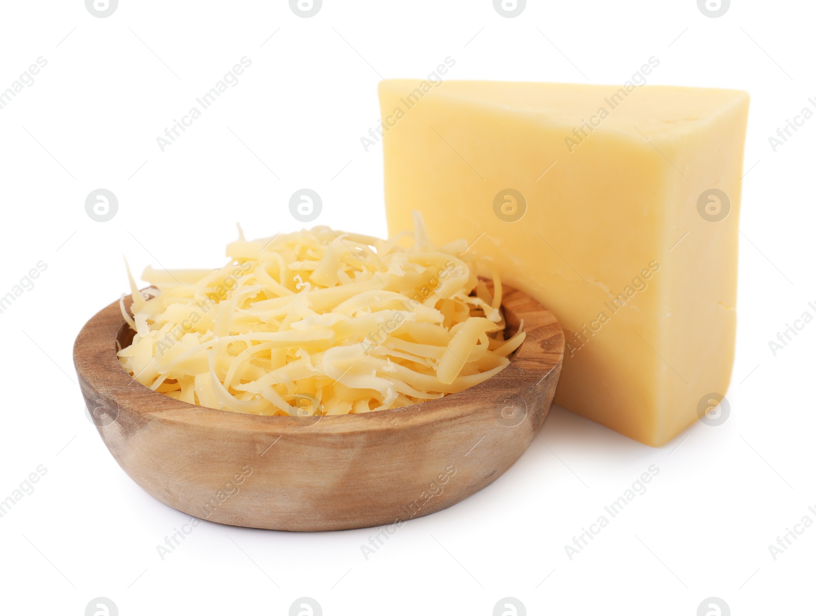 Photo of Grated cheese in bowl and piece of one isolated on white