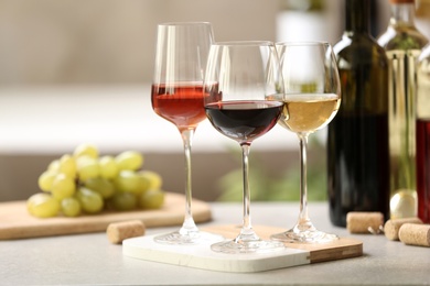 Different glasses with wine served on table