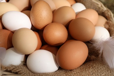 Fresh chicken eggs in basket, closeup view