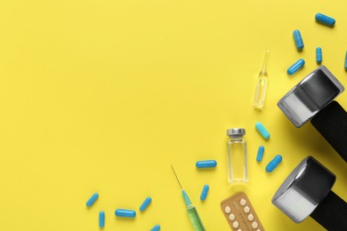 Photo of Flat lay of different drugs and sports equipment on yellow background, space for text. Doping control