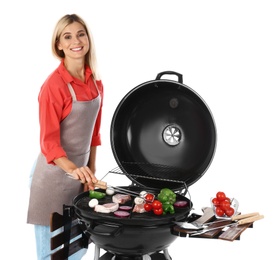 Woman in apron cooking on barbecue grill, white background