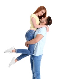 Photo of Young couple in stylish jeans on white background