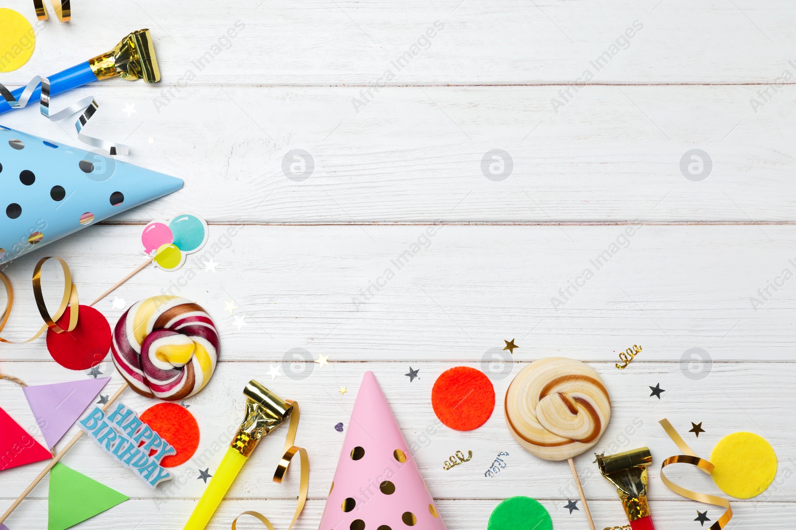 Photo of Flat lay composition with birthday party items on wooden background