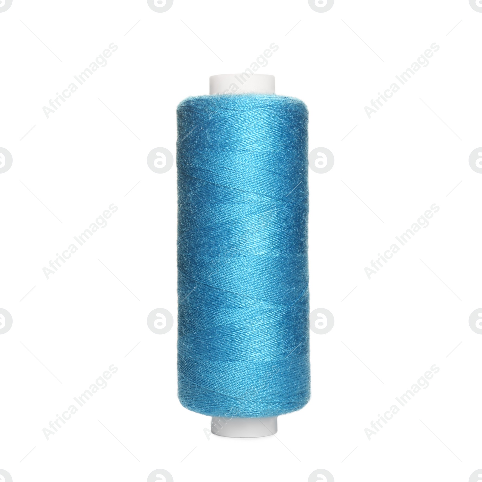 Photo of Spool of light blue sewing thread isolated on white