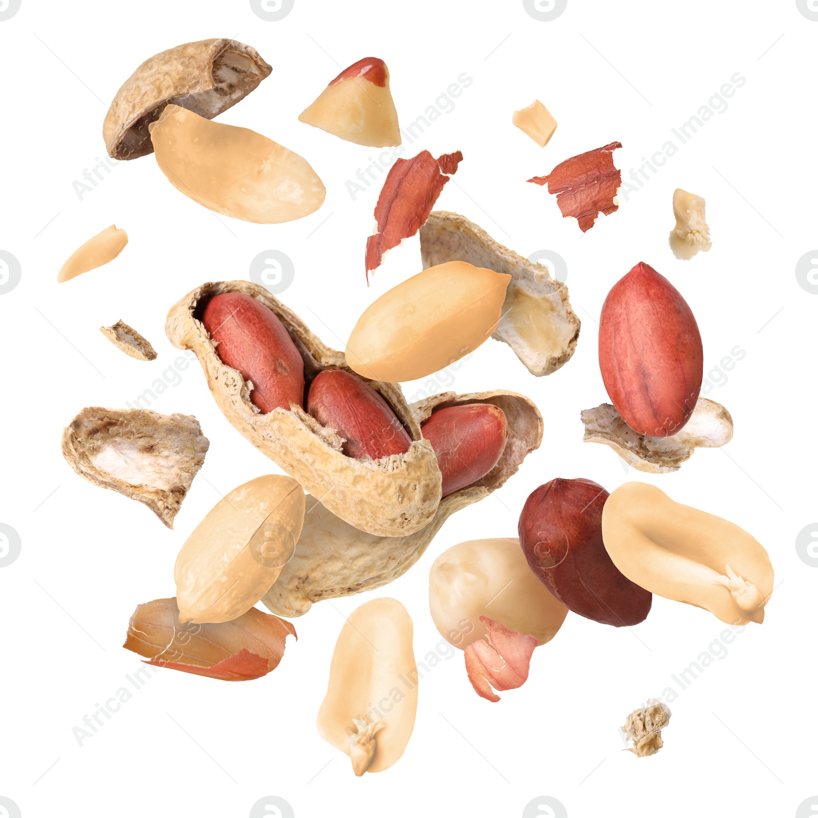 Image of Peanuts and crushed pods in air on white background