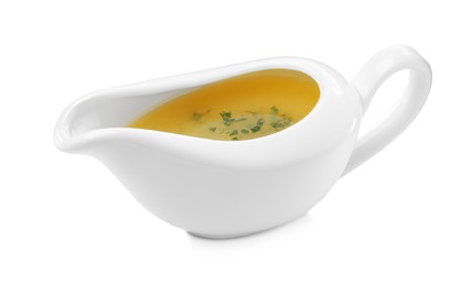 Photo of Ceramic sauce boat with lemon salad dressing on white background