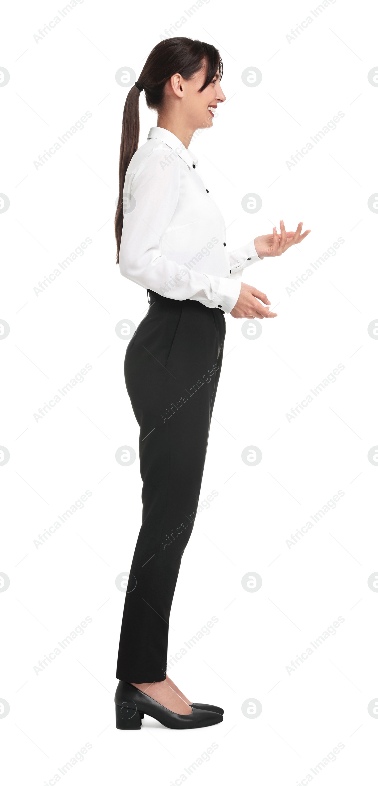 Photo of Happy businesswoman in shirt and black pants on white background